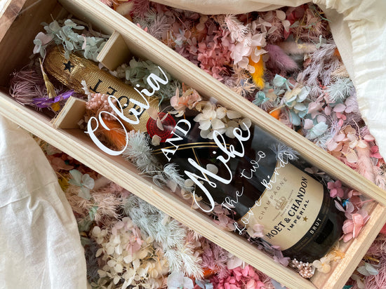 Send a special gift in style with this personalised champagne bottle box. The attractive wooden box features a clear acrylic lid, perfect for adding custom messages and unique personalisations. Show off your special gift to the recipient with this beautiful and thoughtful presentation.