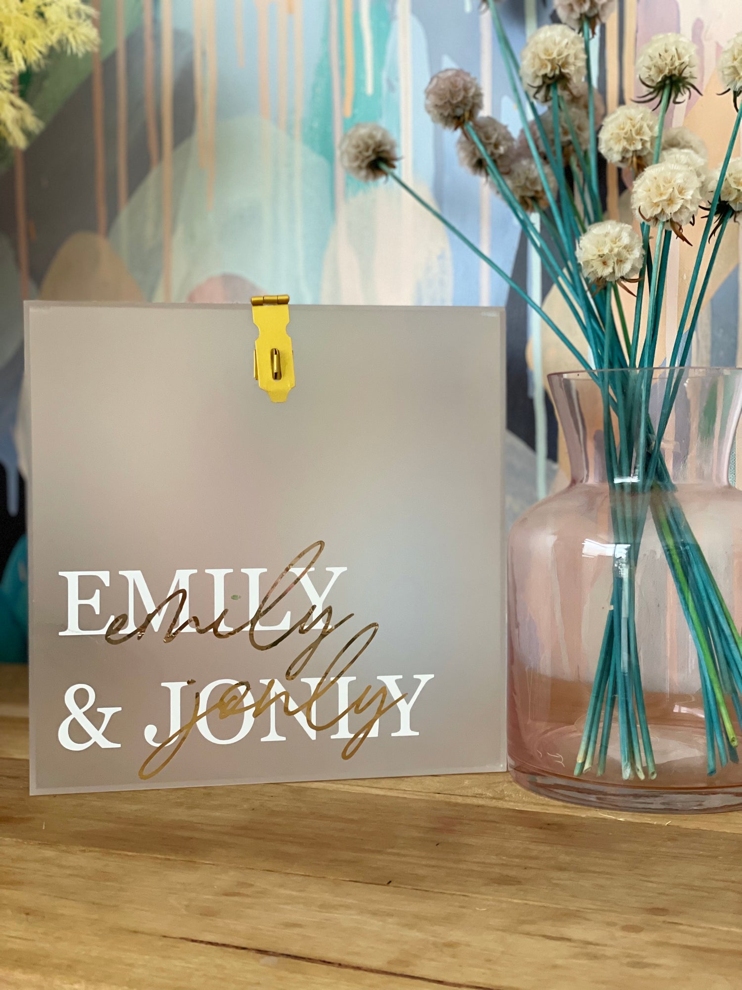 This Frosted Acrylic Wishing Well is the perfect addition to your wedding decor. With its timeless style, your guests will be sure to notice this beautiful and elegant addition to your special day. The acrylic material adds a modern feel to a timeless classic, providing you with a unique and stylish way to style your wedding.